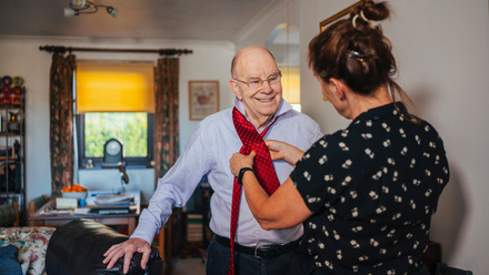 man dementia helping to dress.jpg