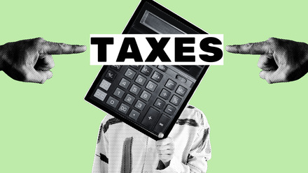 hands pointing at a calculator head with taxes text