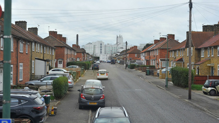 residential street with town background.jpg