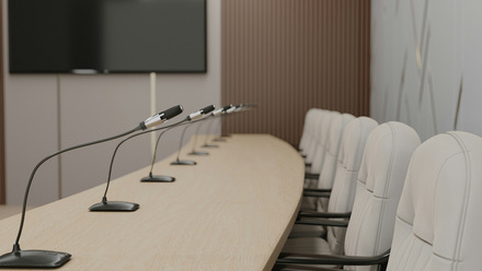 row of seats with microphones