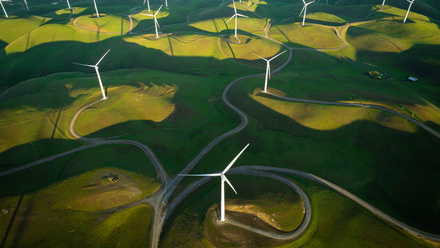 green field with wind farm