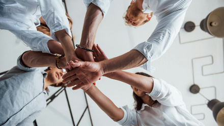 team huddle with hands