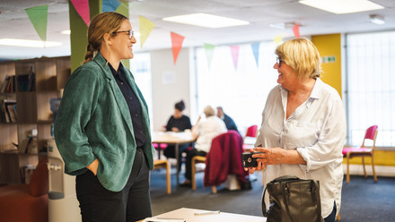 two female colleagues talking