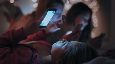 child scrolling on phone