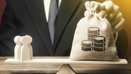 bigstock-Man-Puts-Money-Bag-And-People--344424568.jpg