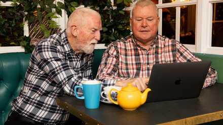two men looking at a laptop.jpg