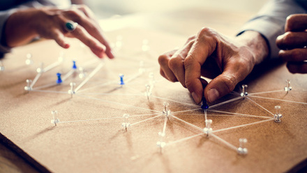 business network with pins and thread