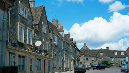 english town with old houses and car parked