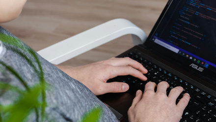 person sat down doing coding