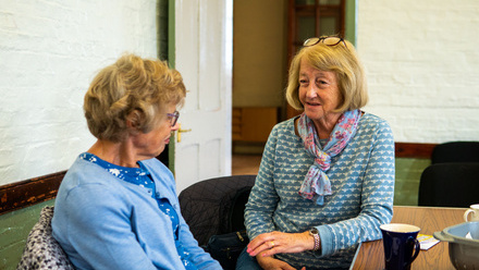 two women discussing matter