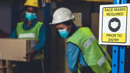caution sign in factory to wear a mask